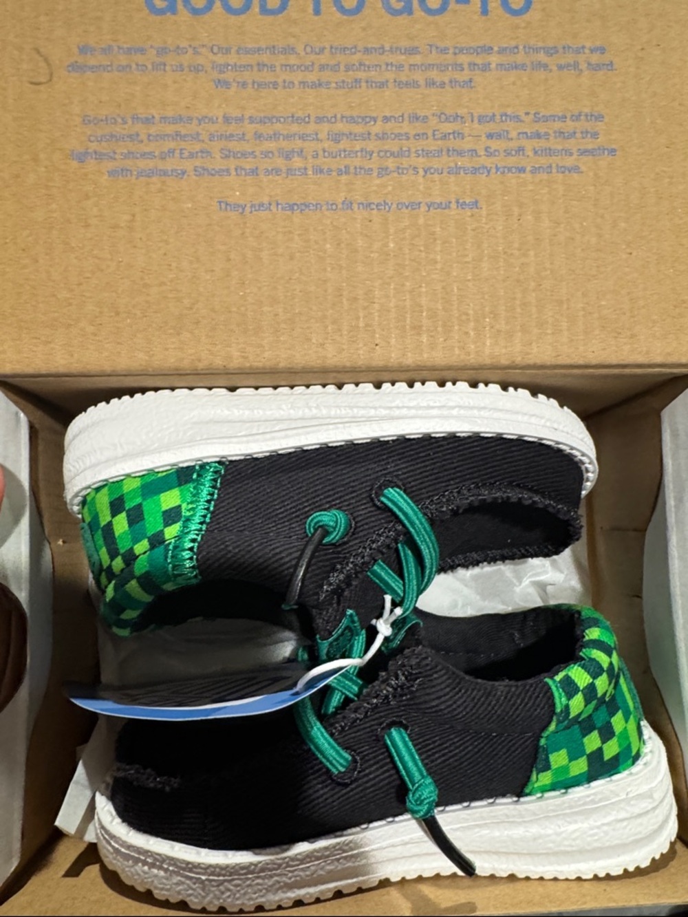Hey Dude Kids Black Canvas Slip-Ons with Green Checkered Heel